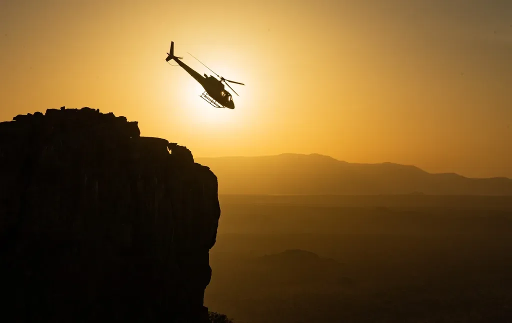 Helicopter sundowner flight over Samburu at sunset, Sasaab Kenya