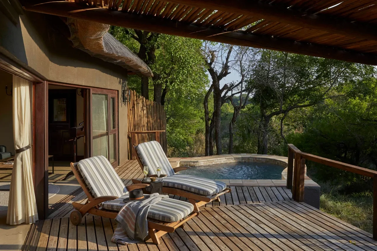 Suite deck loungers with private plunge pool and bush views at Lion Sands Tinga Lodge, Greater Kruger