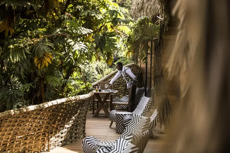 Private deck dining service at Bisate Lodge among the forest Rwanda