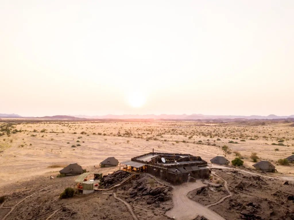 Aerial view of Wilderness Doro Nawas lodge at sunset in Damaraland, Namibia
