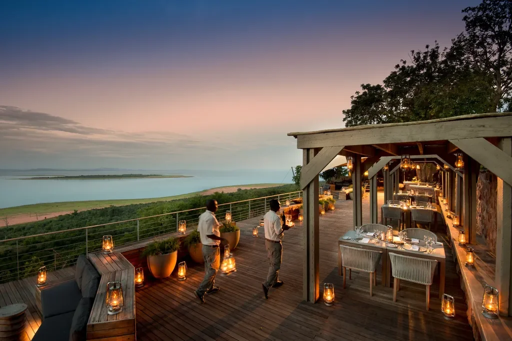 Lantern-lit dinner terrace overlooking Lake Kariba at Bumi Hills Safari Lodge, Zimbabwe