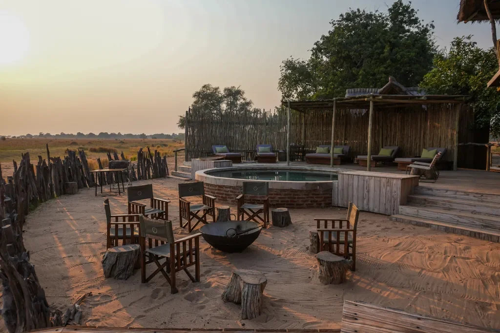 Boma firepit and circular seating at dusk, Nyamatusi Mahogany, Mana Pools, Zimbabwe