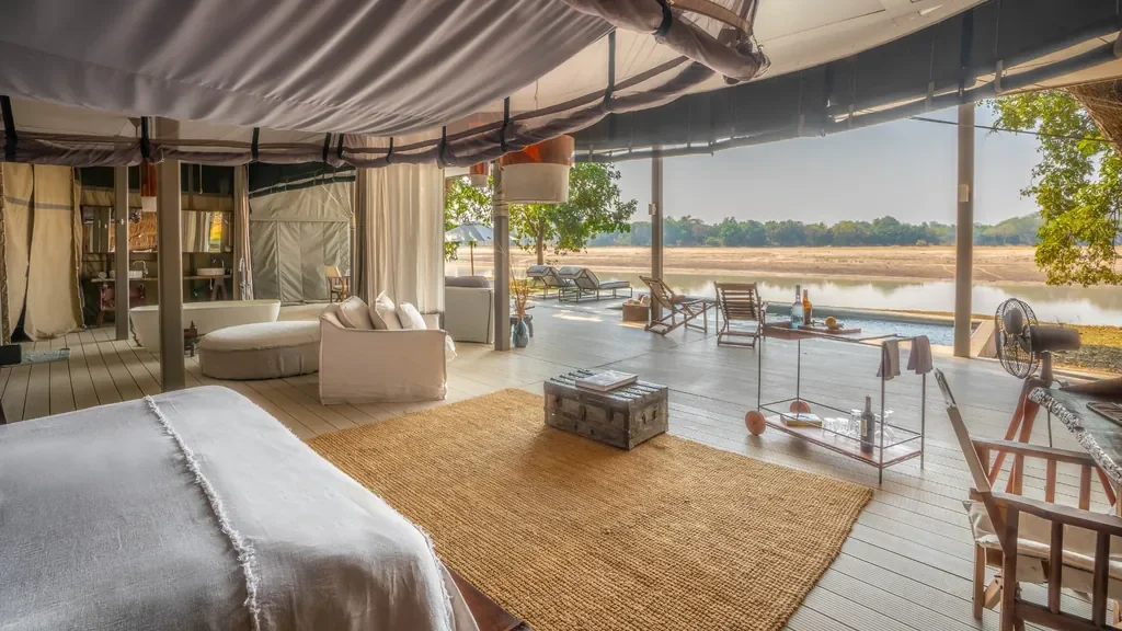 Exterior of open‑plan villa at Time + Tide Chinzombo with plunge pool and shaded deck, South Luangwa, Zambia