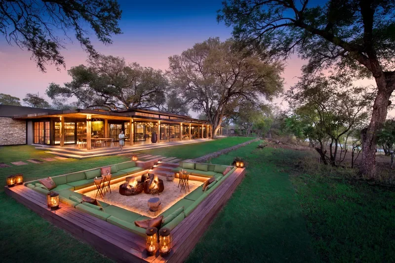 Sunken fire pit lounge at Tengile River Lodge main area beside the Sand River