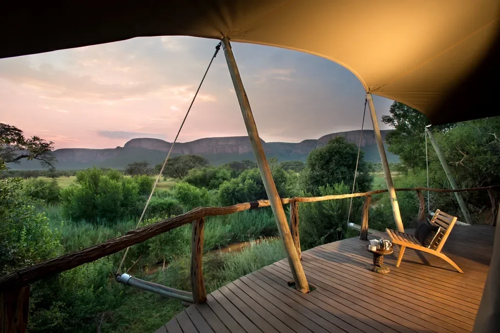 Private tented suite deck with sunrise view of the Waterberg range, Marataba Safari Lodge