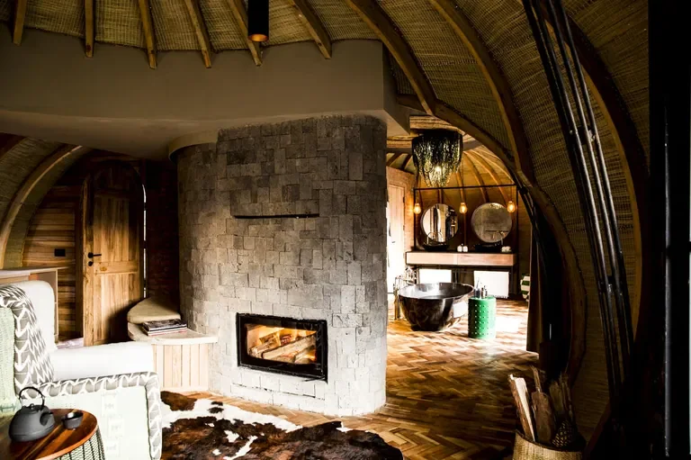 Bisate Lodge fireplace and luxury bathroom, Volcanoes National Park Rwanda