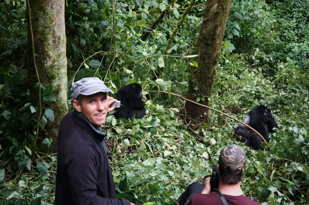 bwindi-gorilla-trekking-trekkers-and-gorillas-in-forest.webp