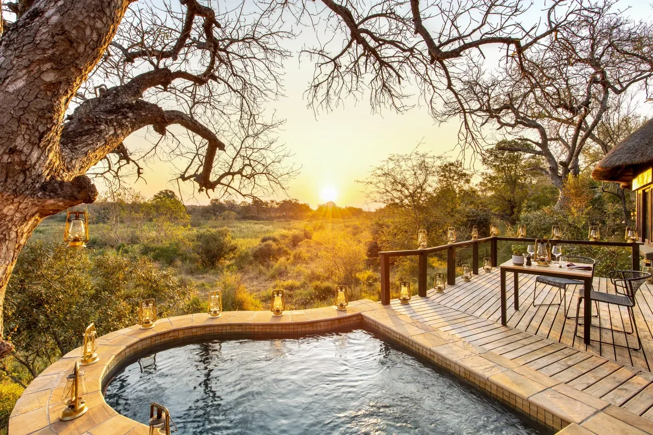 Private plunge pool on a suite deck at Lion Sands Tinga Lodge at sunset, romantic safari in South Africa