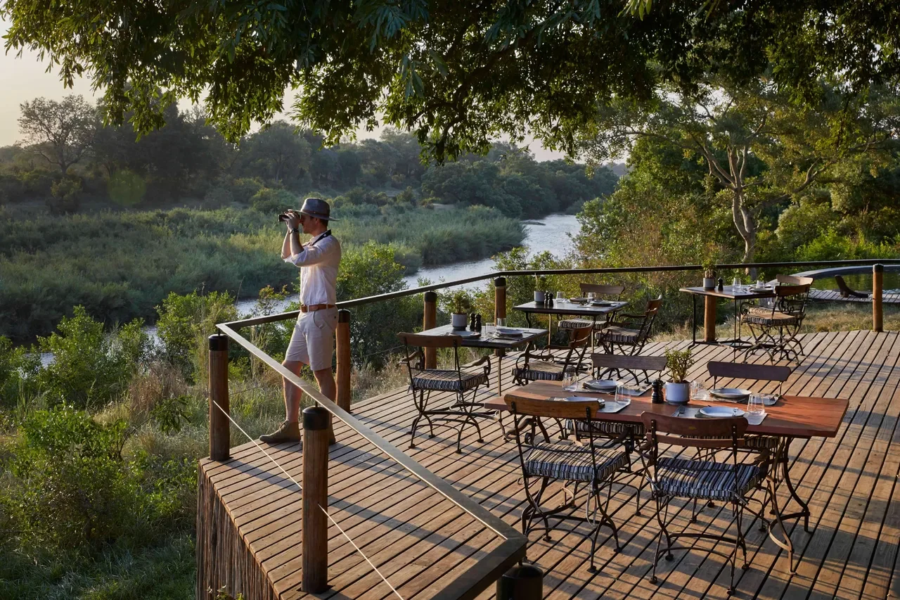 Lower river deck at Lion Sands Tinga Lodge overlooking the Sabie River for breakfast and wildlife viewing, Greater Kruger
