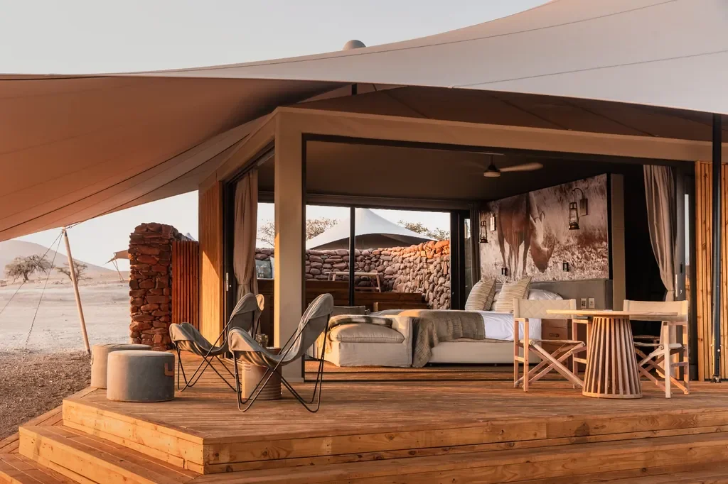 Suite exterior with stretch canvas canopy and wooden deck at Desert Rhino Camp, Damaraland Namibia