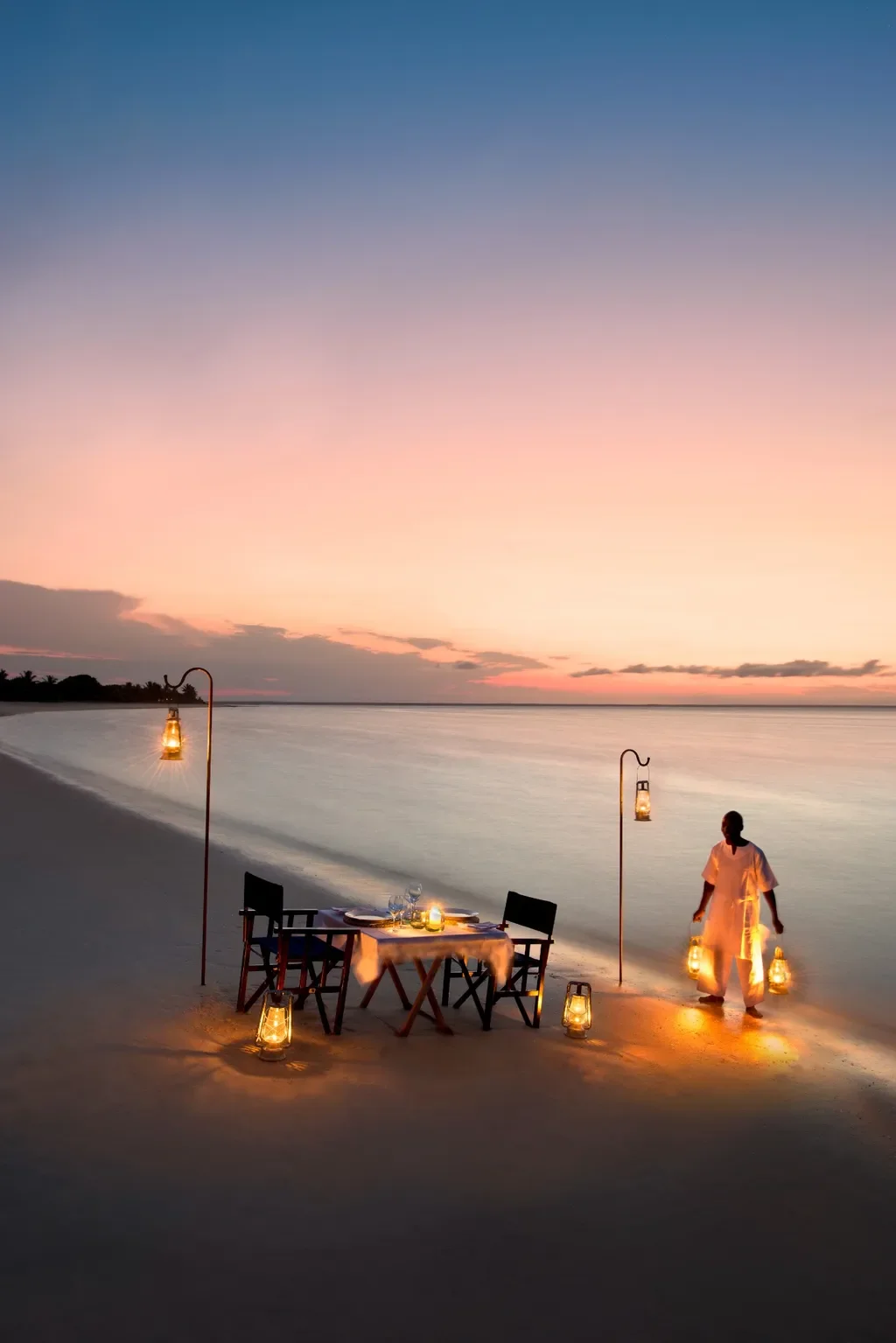 private beach dinner with lanterns – andBeyond Benguerra Island, Mozambique