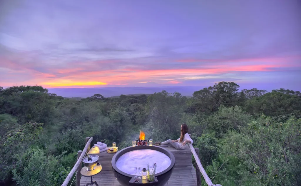 Private hot tub deck at The Highlands with sunset views over Ngorongoro highlands