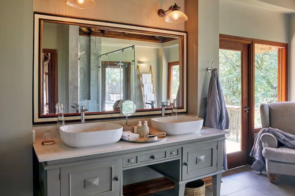 Luxury bathroom with double vanity in a suite at Lion Sands Narina Lodge, Greater Kruger, South Africa