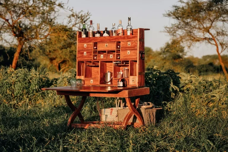 Portable field bar for sundowners at Little Chem Chem, golden hour in Tarangire Tanzania