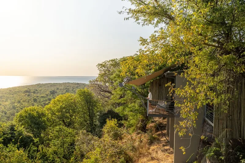 Suite balcony nestled in trees with wide Lake Kariba views at Bumi Hills Safari Lodge, Zimbabwe