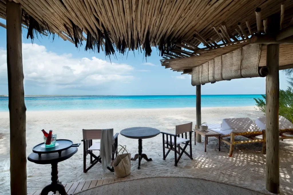 Private beach banda sunbeds by the ocean – Mnemba Island, Zanzibar, Tanzania