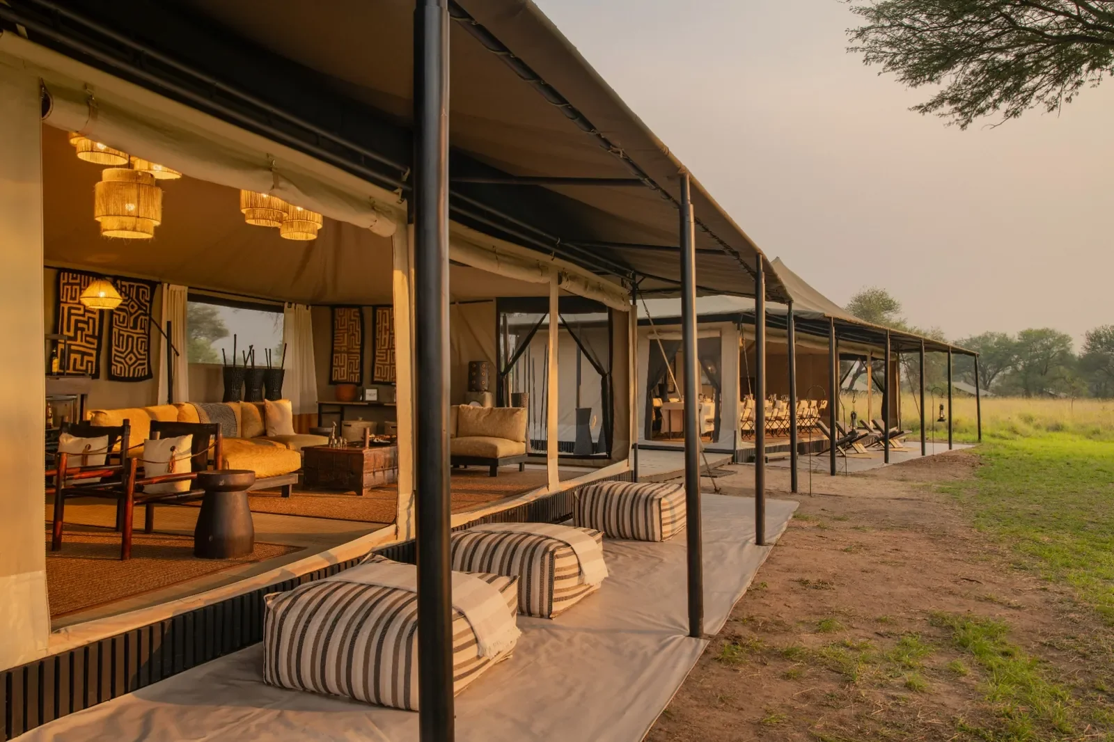 Exterior of the main area at Ubuntu Migration Camp, open sided canvas lounge facing the Serengeti grasslands, Tanzania