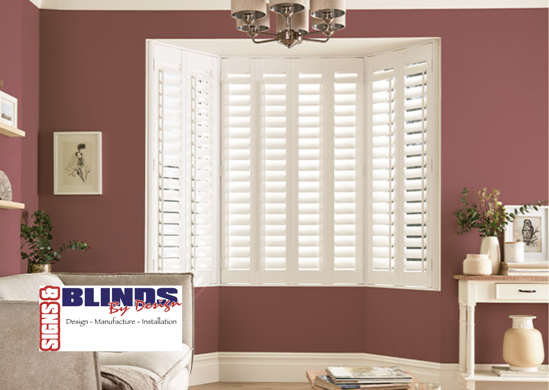 Living room with a large bay window fitted with white plantation shutters. Meet Signs and Blinds by Design based in Kendal, at the Home Interiors & Renovation Exhibition, 20-21 March 2026.   #hirecumbria