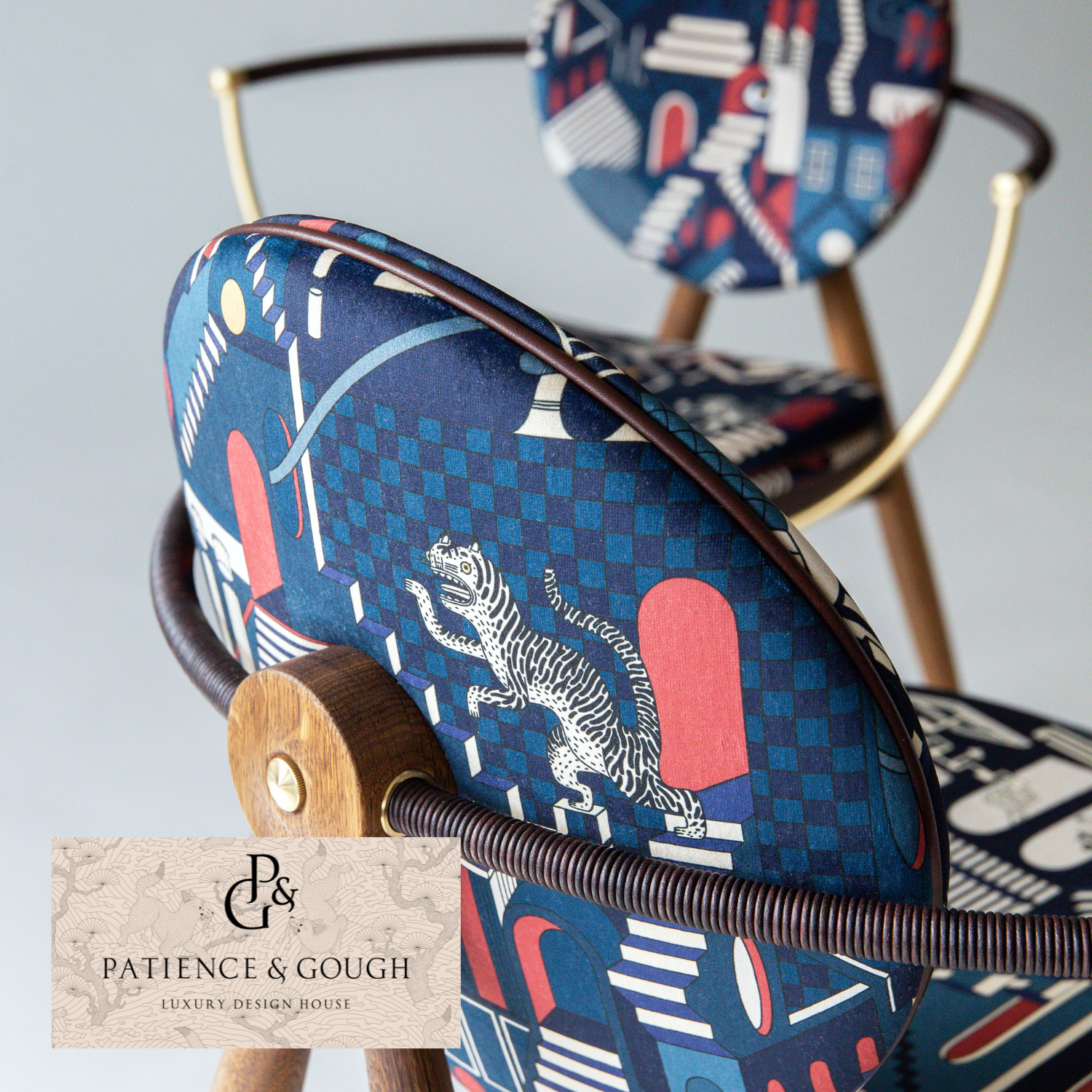 A decorative modern furniture set with a blue and white botanical pattern, includes a sofa, a cabinet, a side table, and a lamp with a red base and a light blue shade, all featuring artwork of tigers and tropical leaves.