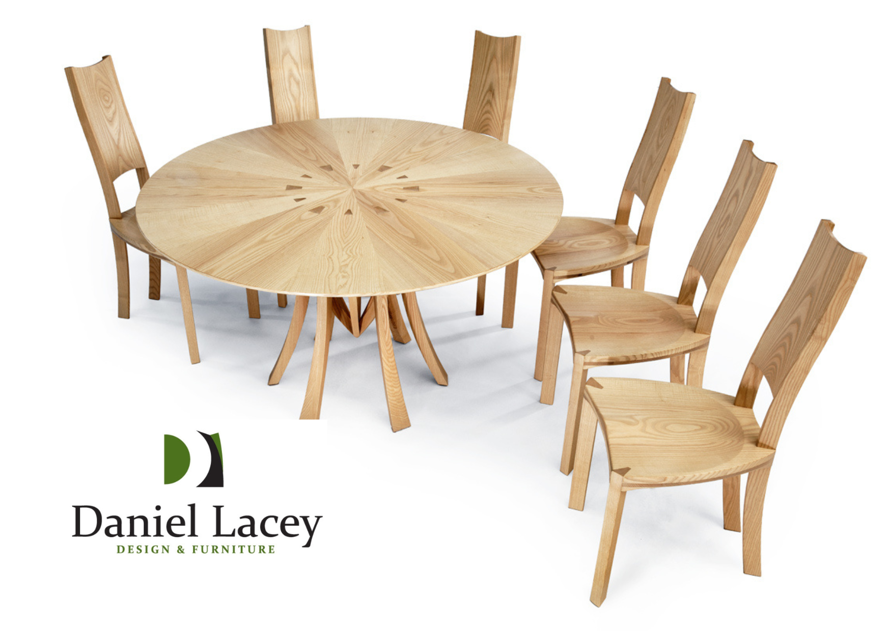 A bespoke crafted round wooden dining table with a radial grain pattern and six matching wooden chairs arranged around it. Meet craftsman Daniel Lacey Design at the Home Interiors & Renovation Exhibition, 20-21 March 2026.   #hirecumbria  