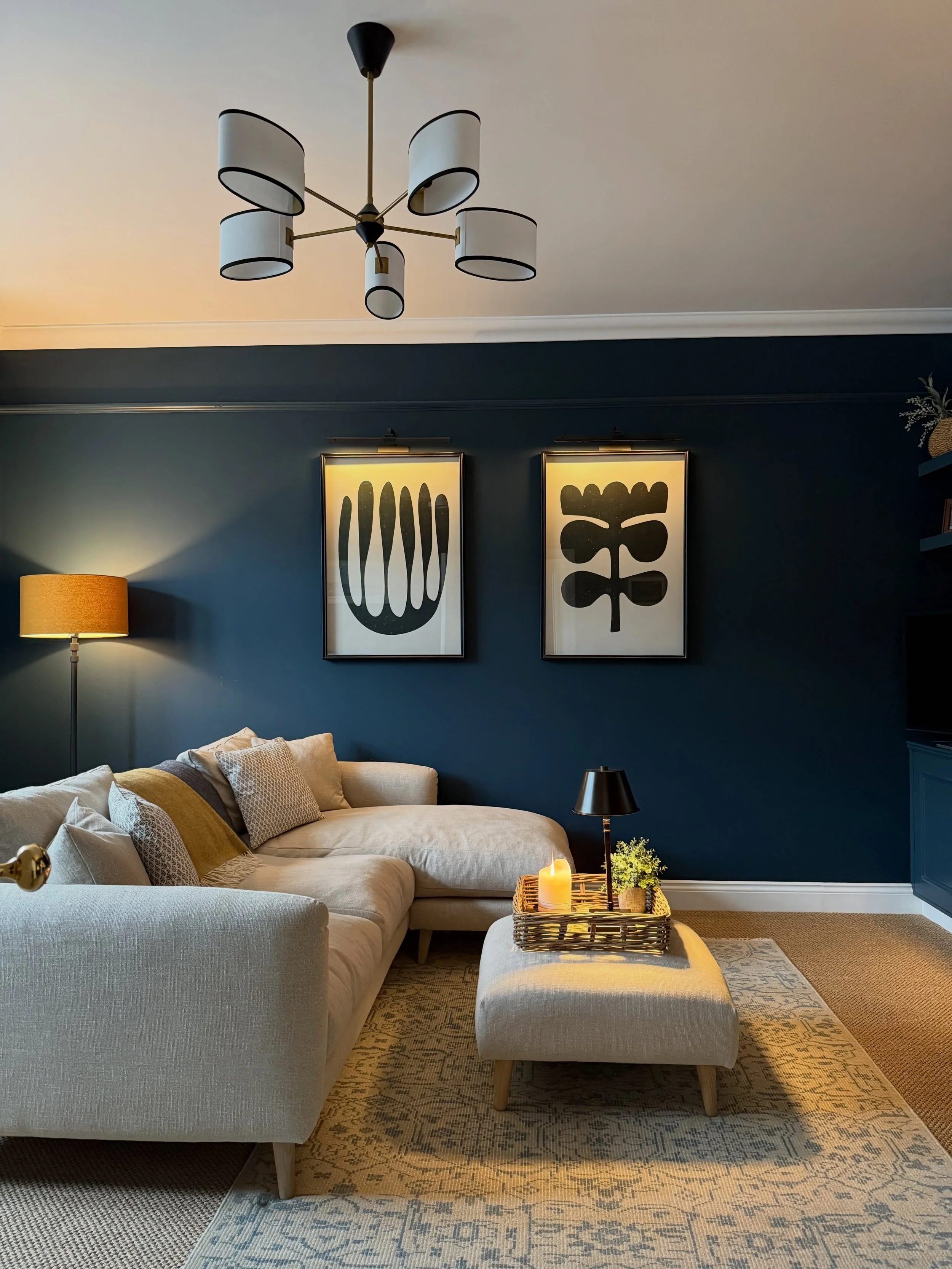 Loved designing this dark, moody lounge for my clients&rsquo; home in Harpenden. The deep navy walls create such a rich, cocooning feel, beautifully balanced by the light fabric sofa which brings softness and contrast to the space.

We layered in tou