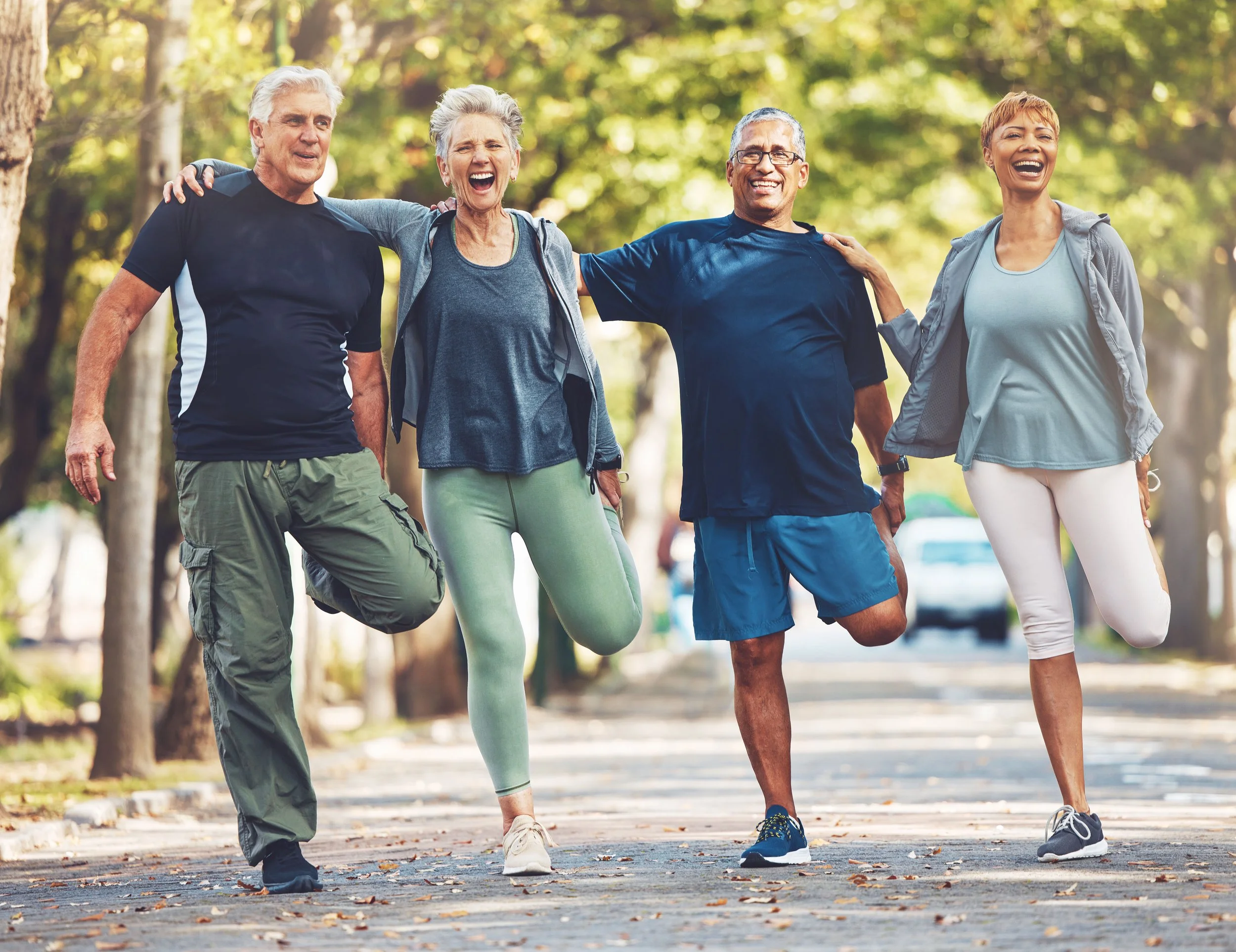 Senior-friends,-stretching-exercise-and-park-with-smile,-wellness-and-self-care-in-summer-sunshine.-Elderly-group-of-people,-fitness-and-healthy-workout-with-motivation-for-health,-nature-or-teamwork-1470475749_4273x3292.jpg