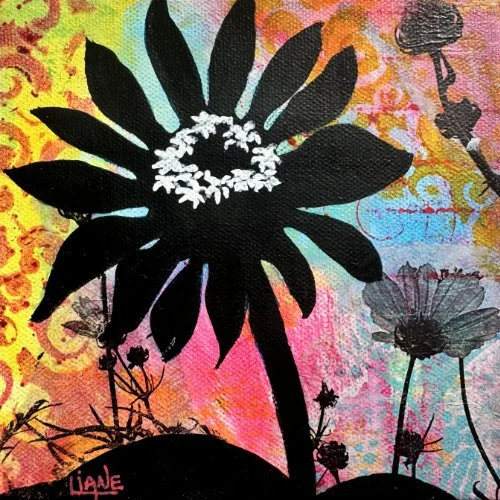 Stencil-style painting of a large sunflower with a ring of white flowers in the center, set against a colorful abstract background with smaller flowers and plants.