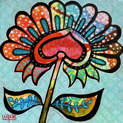 Colorful, stylized flower with a heart-shaped center, decorated in bright patterns and polka dots, on a light blue background.
