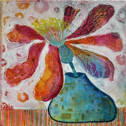 Colorful watercolor painting of a flower with large petals in red, orange, pink, and purple, in a blue vase against a pink and yellow background.