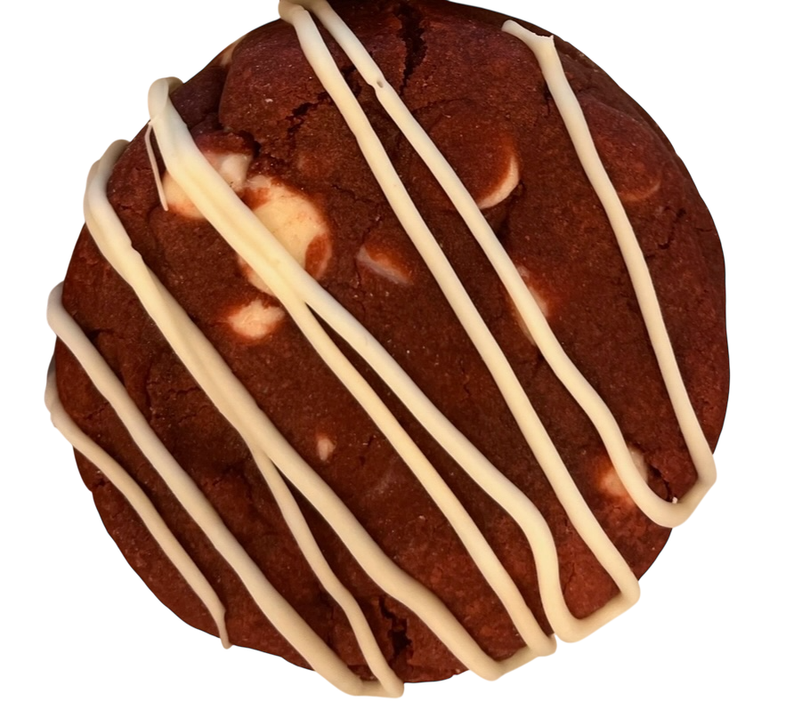 Chocolate cookie with white chocolate drizzle on top.