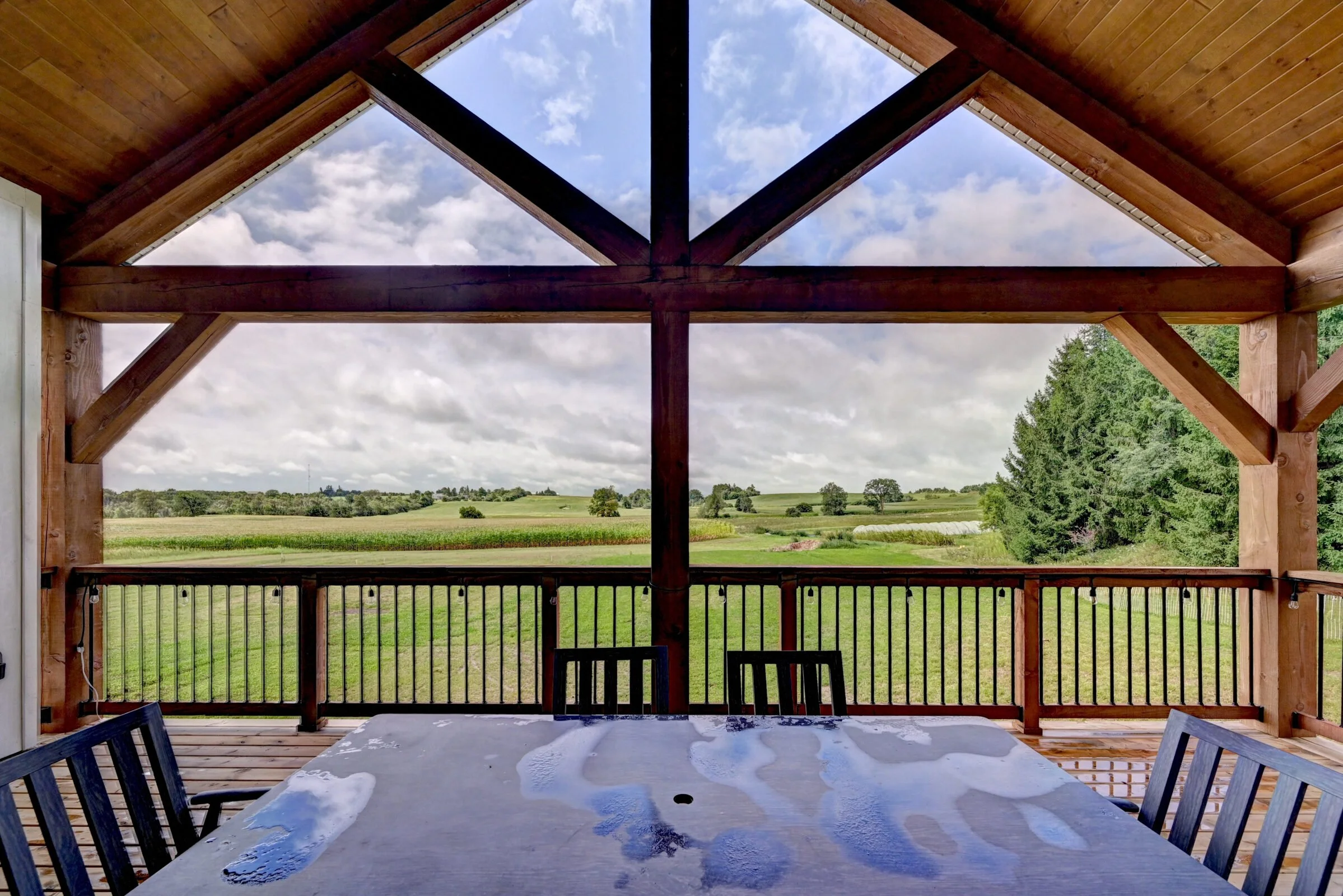 shot of custom truss work within a back porch awning