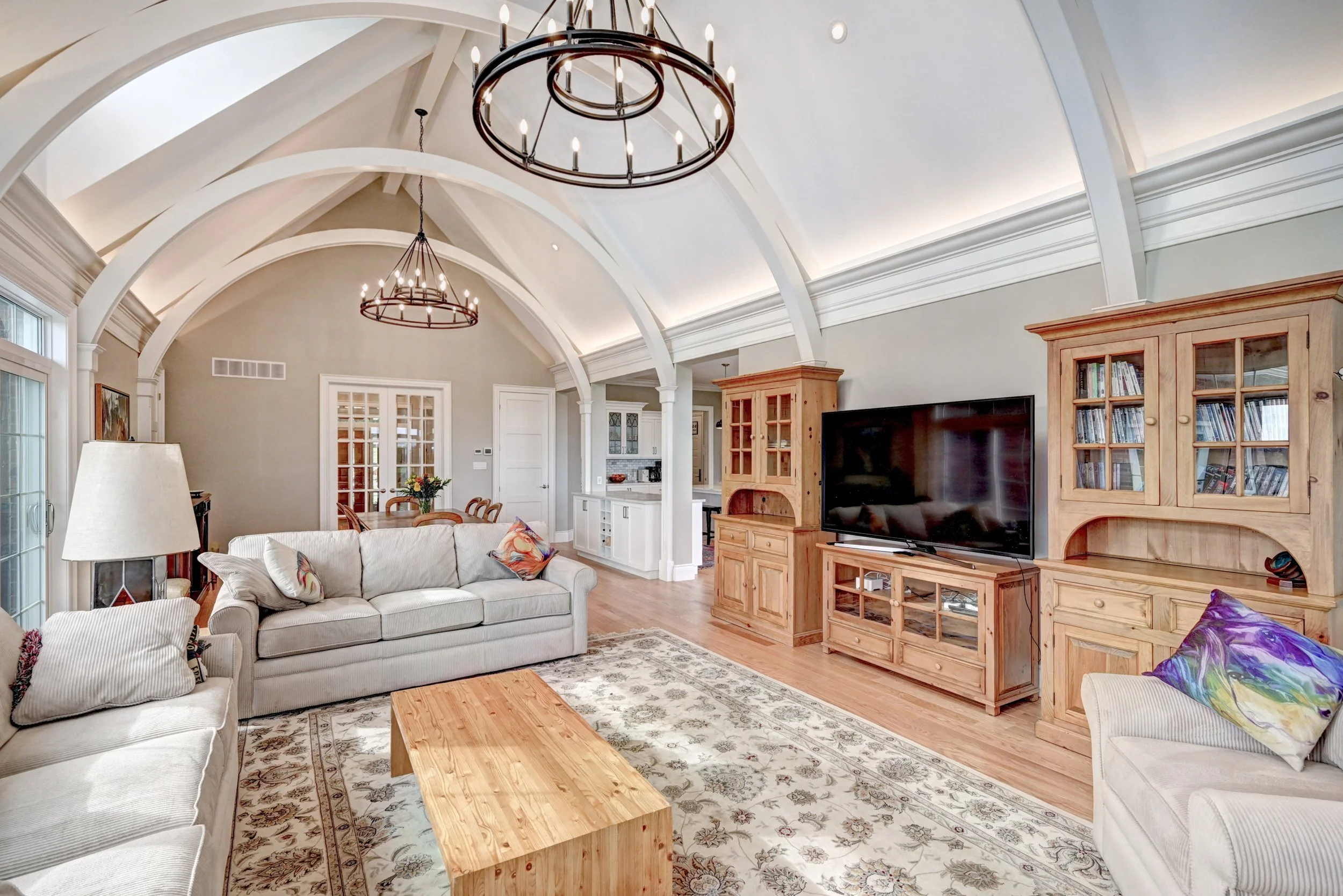 interior mid shot showcasing custom living room and ceiling support details