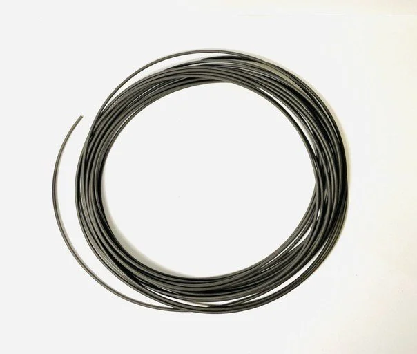 Coil of black metallic wire