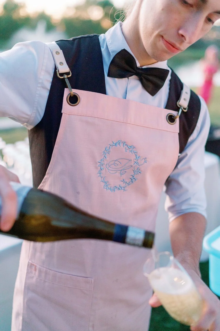 staff pouring champagne