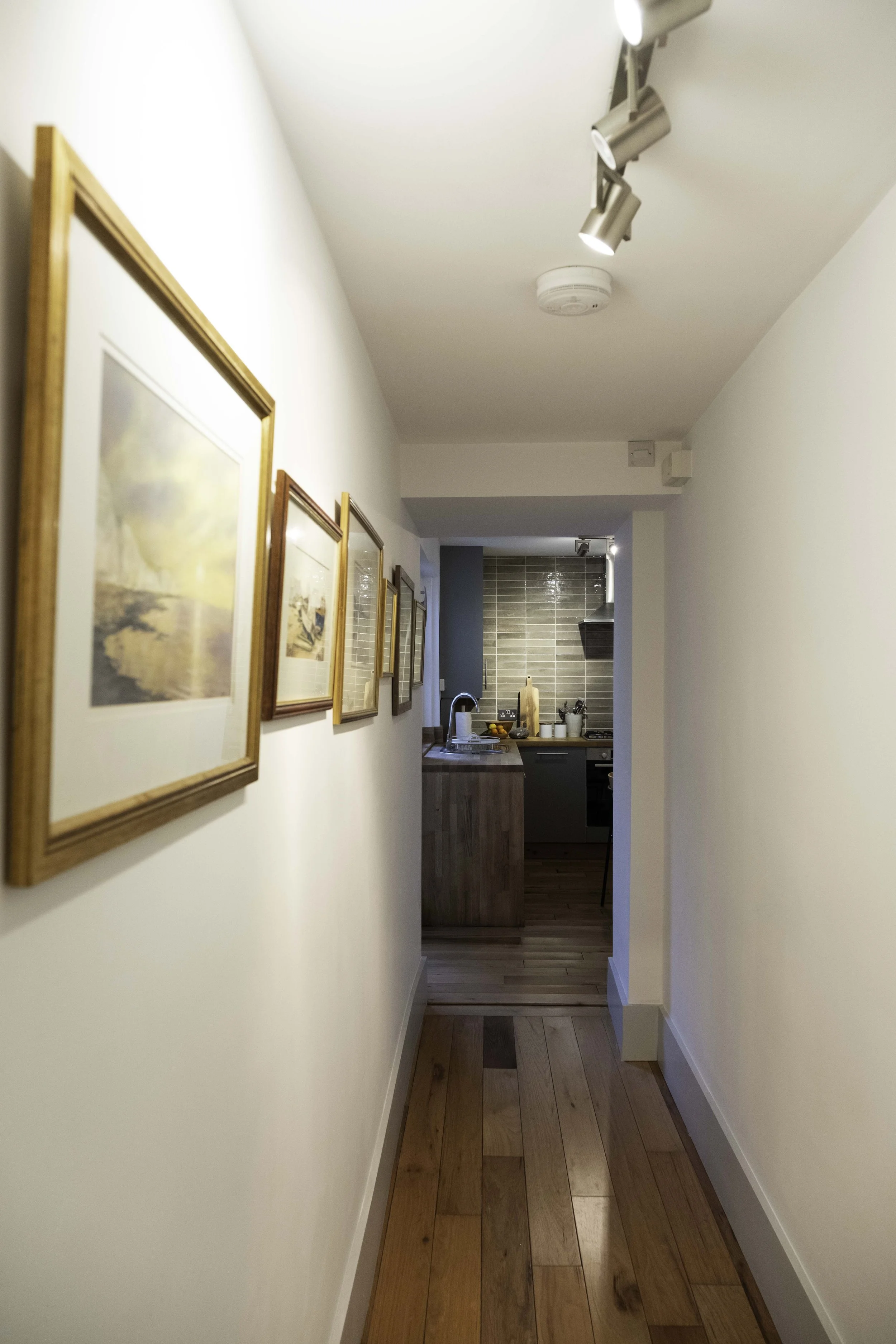 Hallway gallery with original local paintings