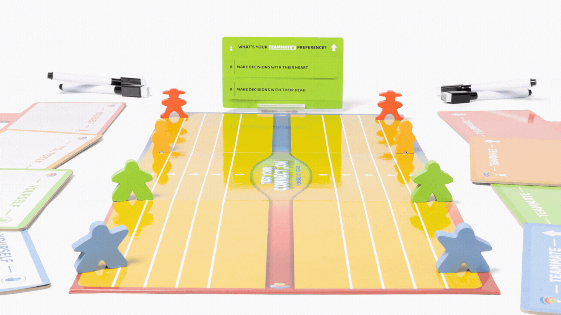 Board game called 'Football Connection' featuring a football field layout, colorful player tokens, decision cards, and a green question card about teammates' preferences.