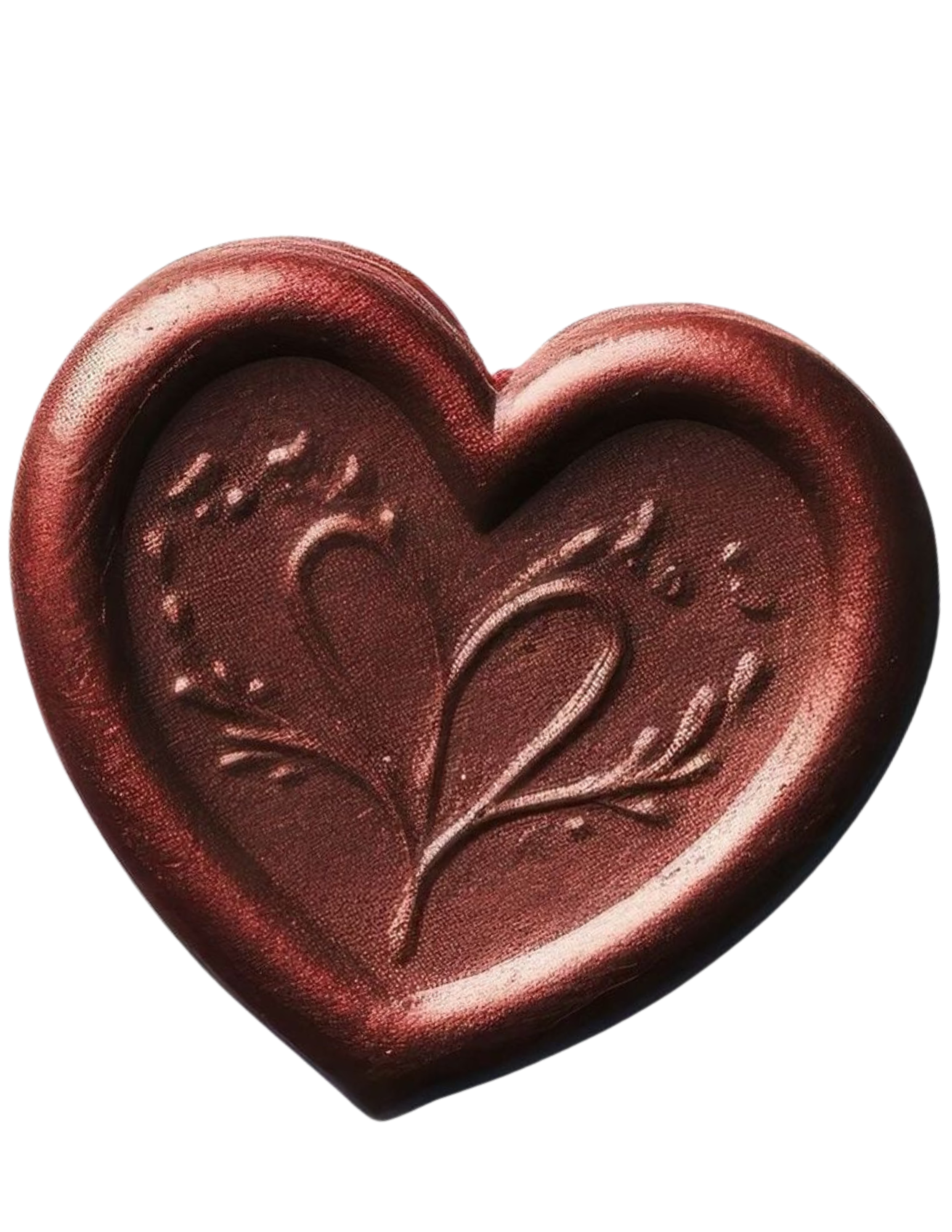 A red, heart-shaped chocolate with an embossed floral design on top.