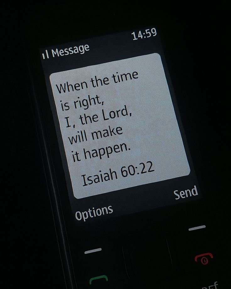 A text message on a mobile phone screen displaying a quote from Isaiah 60:22 about trusting God to make things happen at the right time.