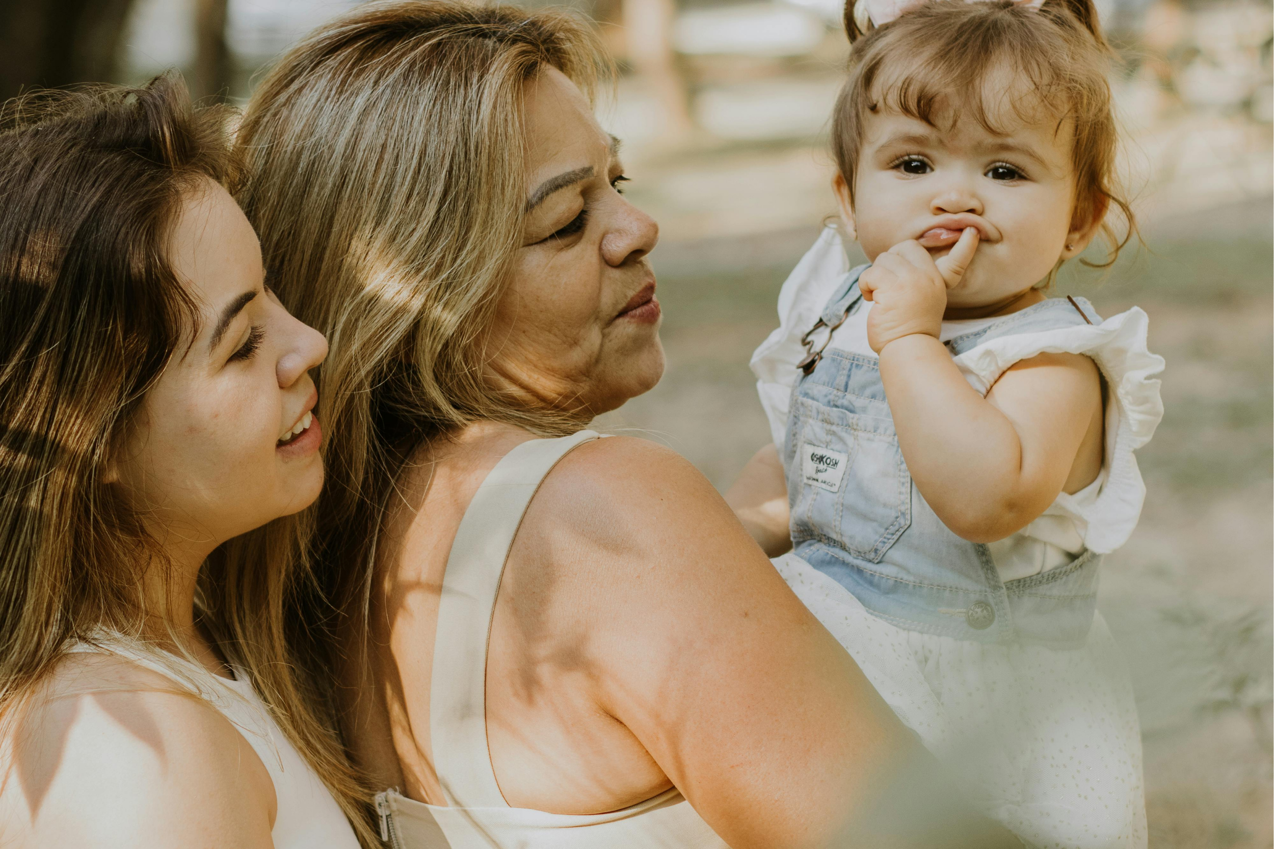 grandmother mother and baby 3 generations of women at women's wellness clinic adrouny village wellness in san jose california
