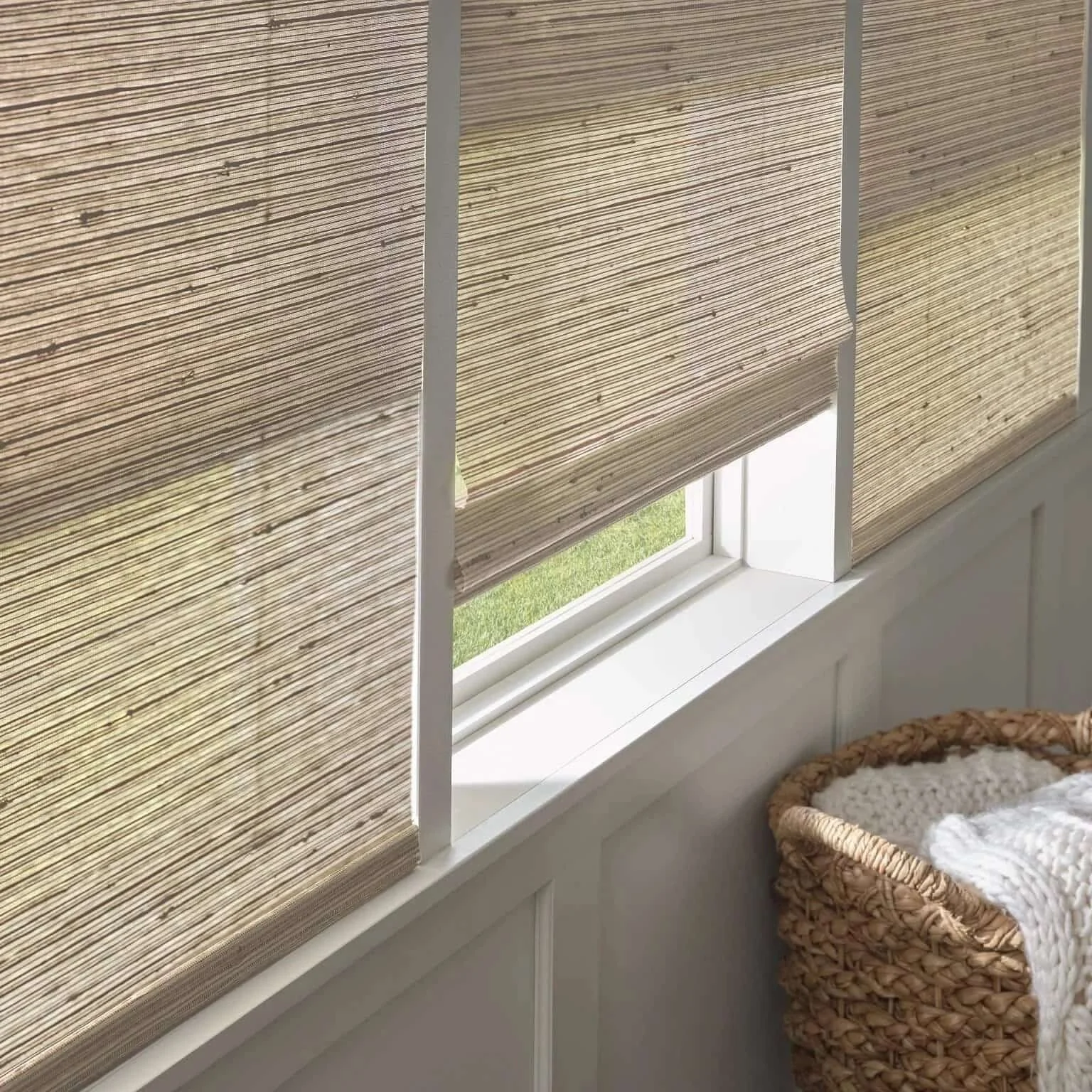 Hunter Douglas® dual shade with a roller shade for blackout privacy behind a woven wood shade