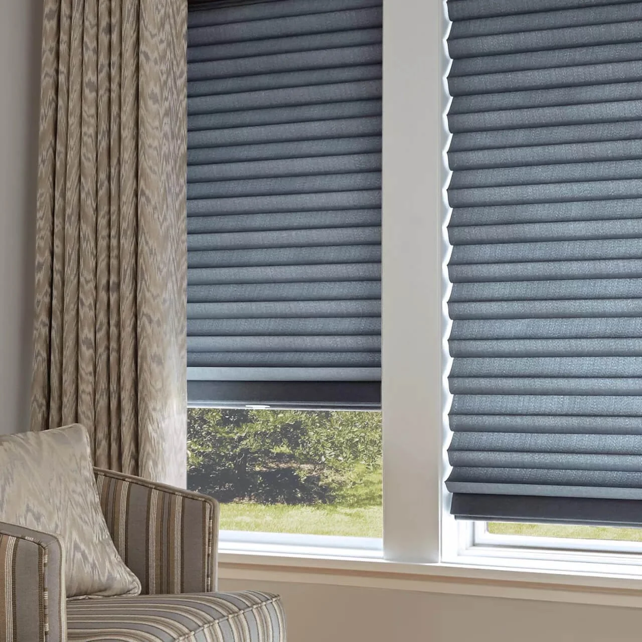 Custom Hunter Douglas roller shades and draperies as a tailored personalized solution for a client