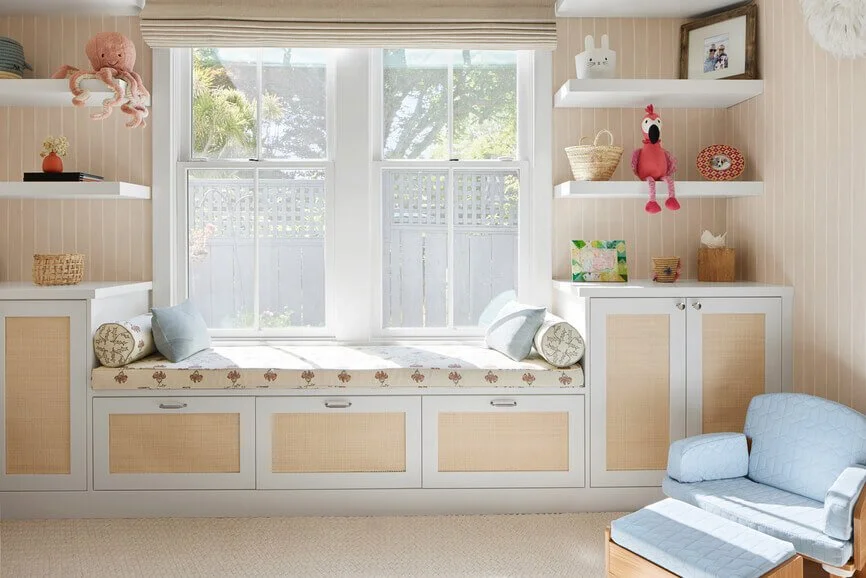 Pillows and cushions on a window seat in a kid's bedroom