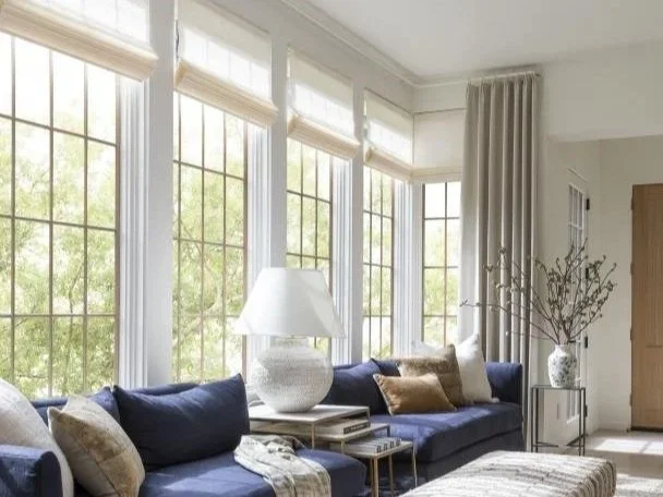 Natural, organic woven wood shades from Hartmann and Forbes, layered with drapes