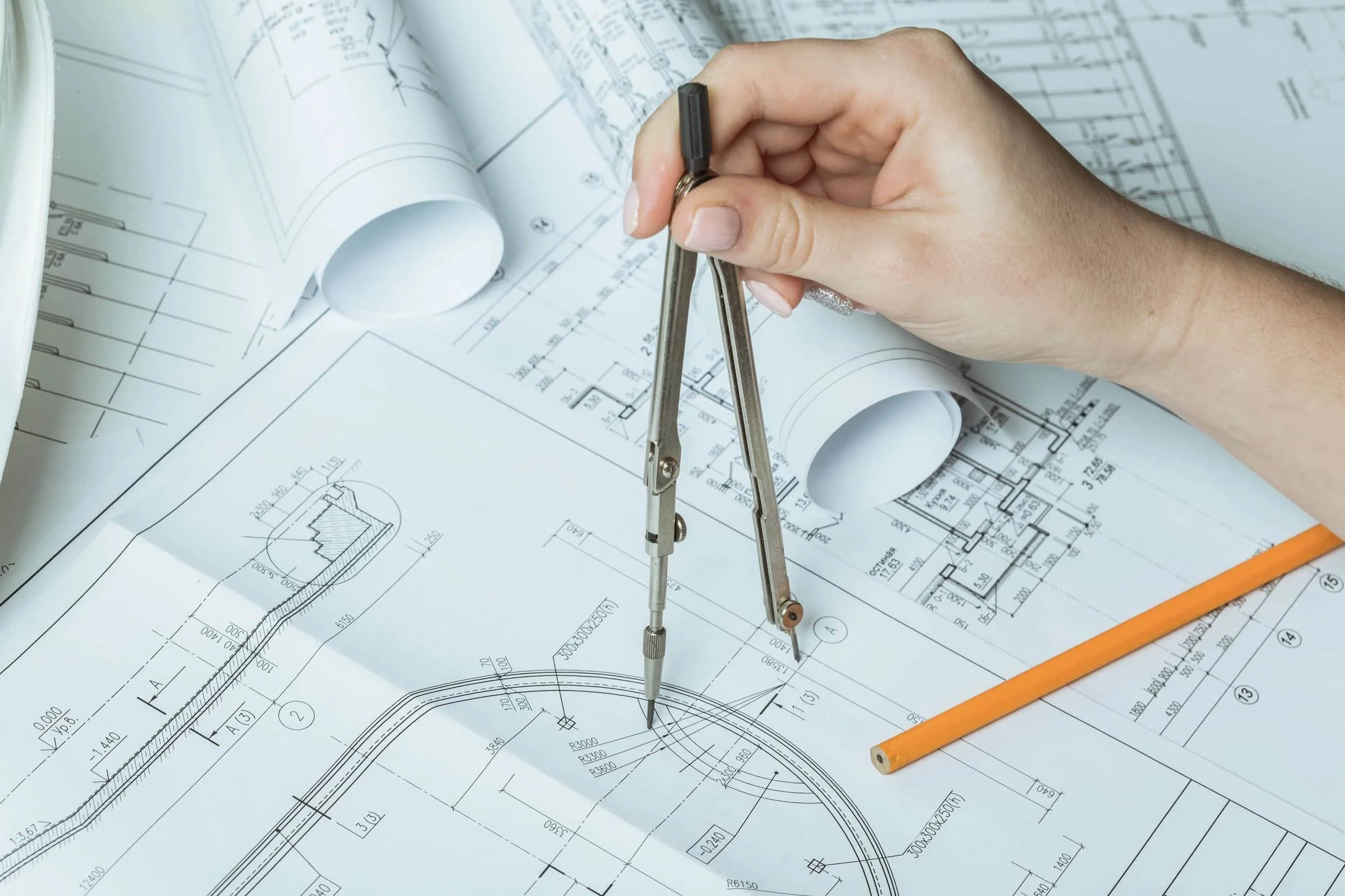 Architectural plans for interior design with a compass