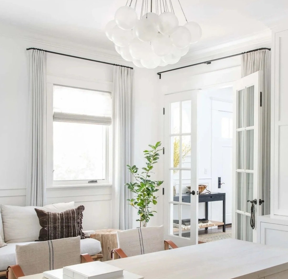 Highland Forge decorative matte black iron hardware with custom white linen drapes