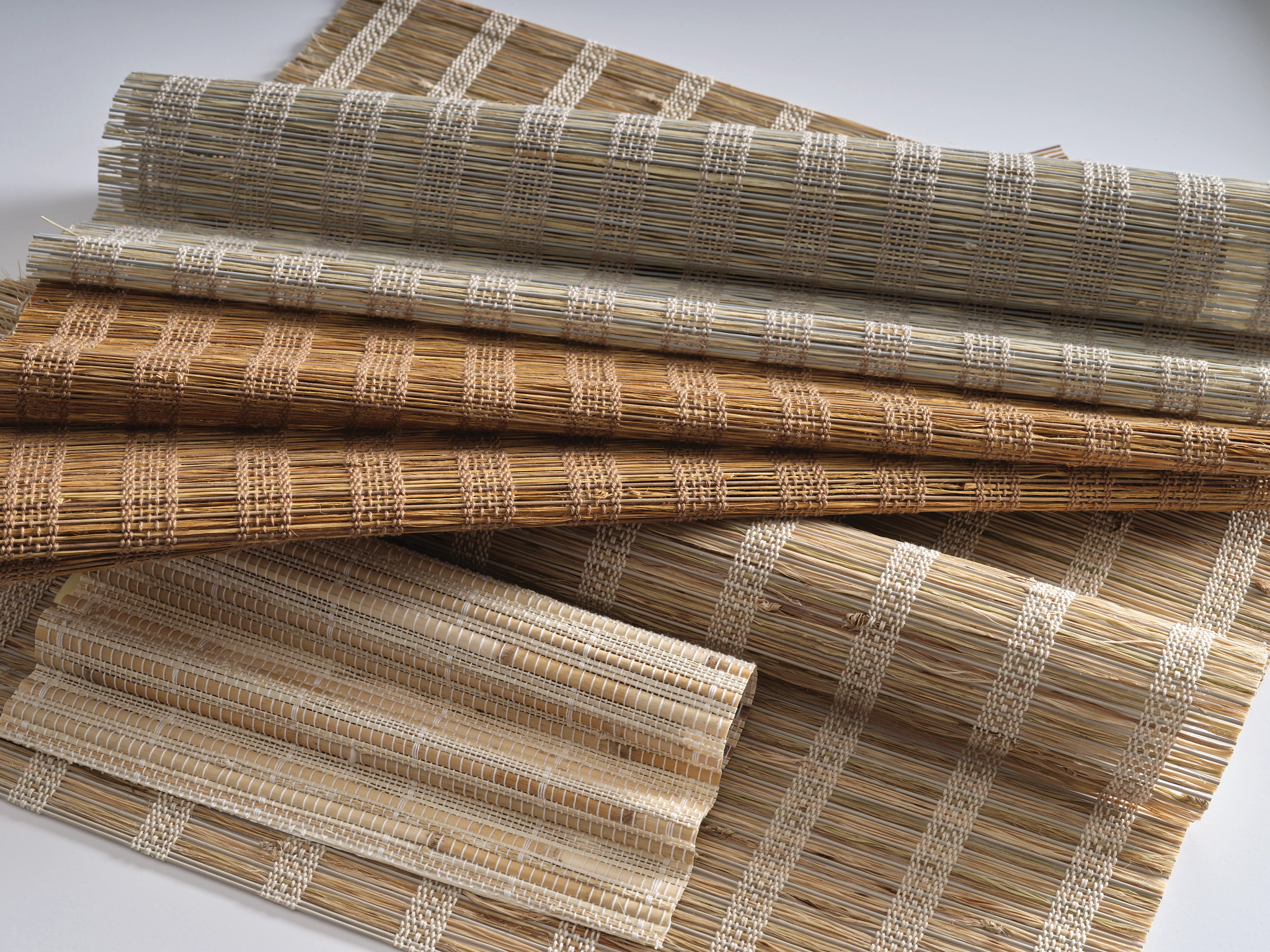 Various types of woven wood shade swatches.