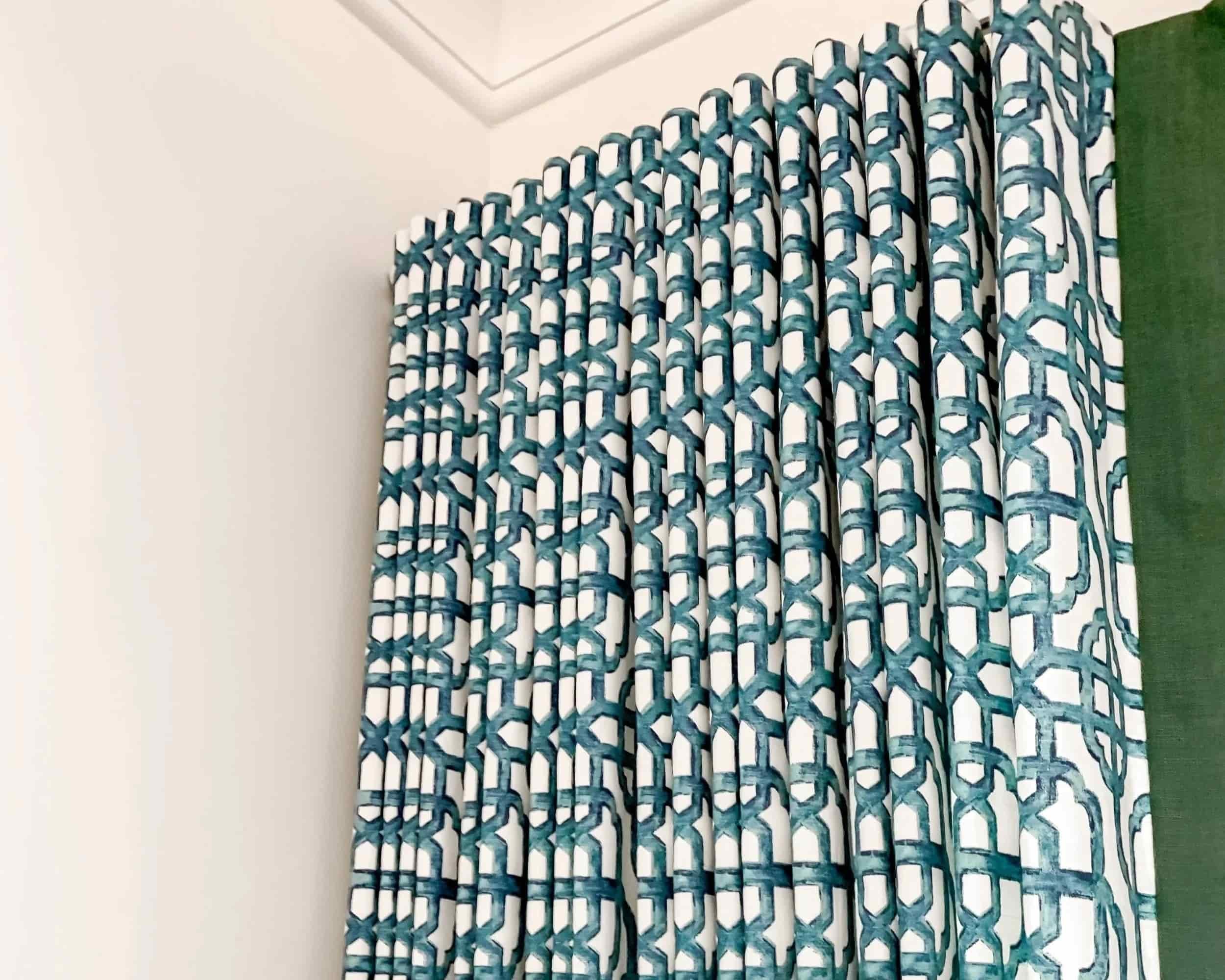 Ripplefold drapes with geometric fabric pleated to pattern and leading edge trim