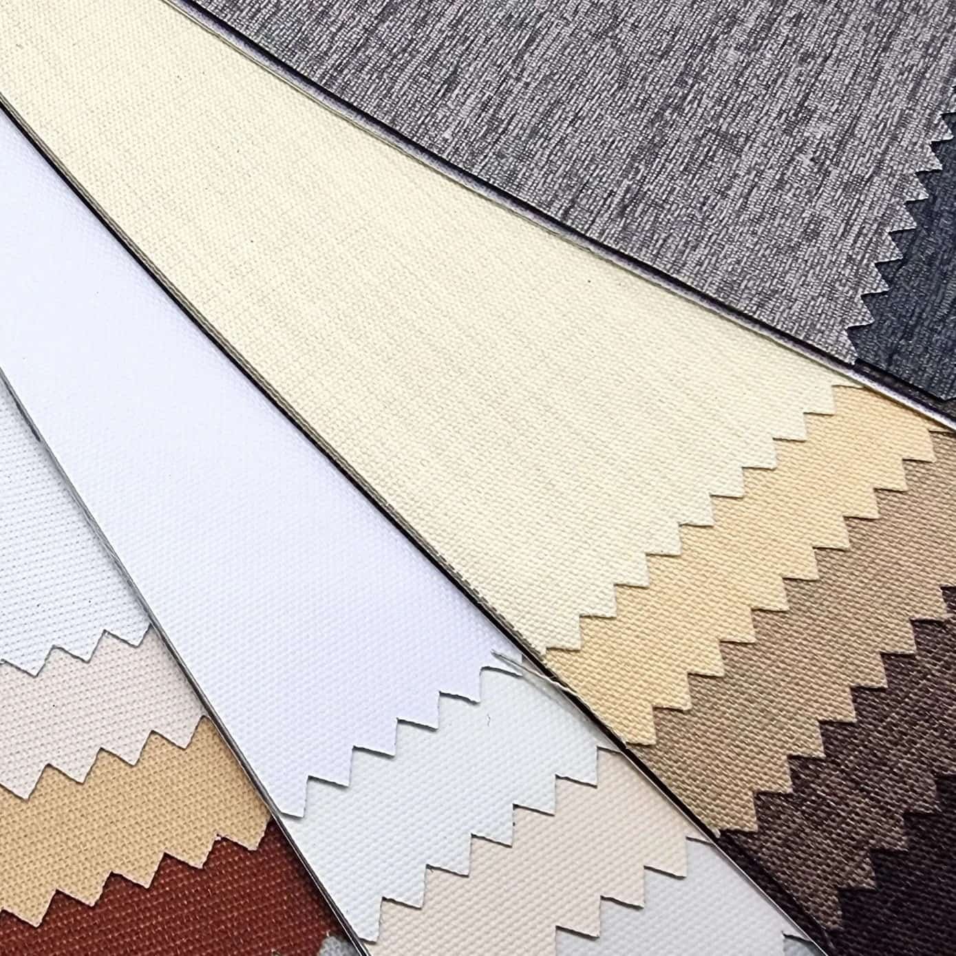 Roller shade fabric swatches in a variety of different colors and textures