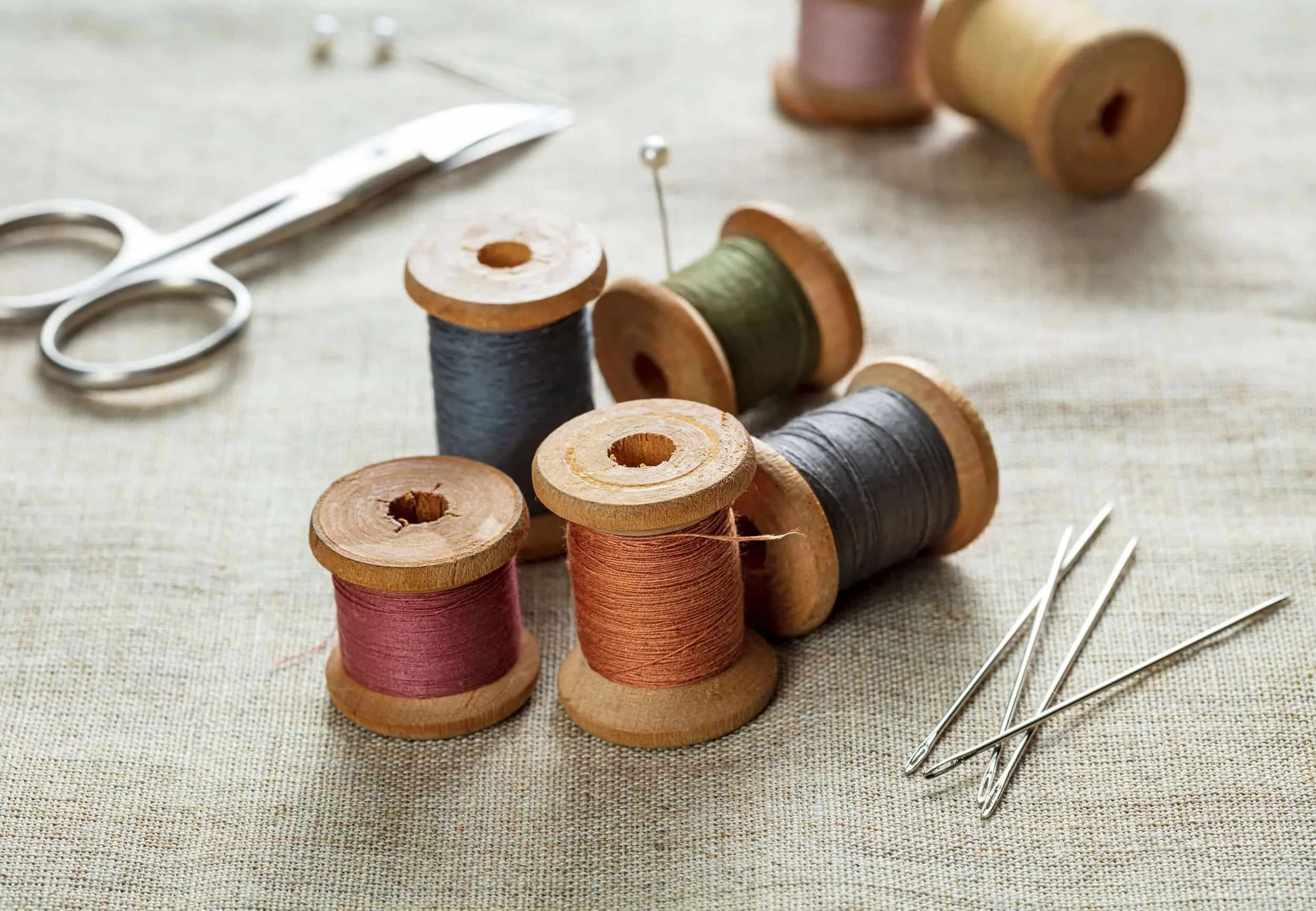 Thread, needles, scissors and other sewing workroom supplies