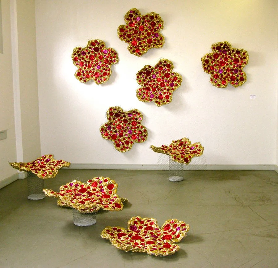 Flowers , 2010, 10 units, 36 x 36 x 6 in., gold lamé, gems, sequin dots, chicken wire, cement